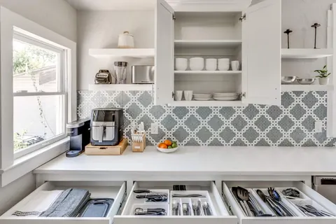 Fully stocked Classen Manor kitchen: organized drawers, air fryer, Keurig and mosaic backsplash